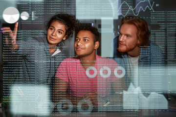 Young team of data analysts are going through endless data streams