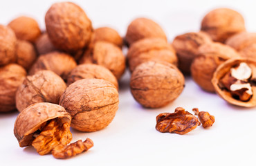Whole walnuts kernels on white background