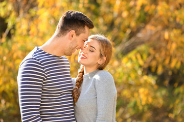 Fototapeta premium Loving young couple in autumn park
