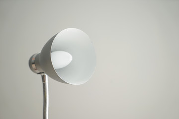 Stylish table lamp on grey background