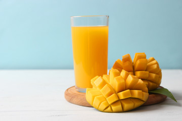 mango juice in a glass and mango fruit.