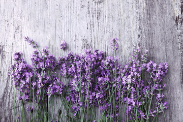 Lavender flowers on wooden background 