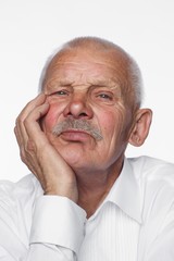 Portrait of old man, posing in studio on white background
