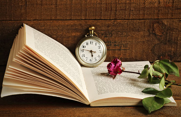 Withered rose and book