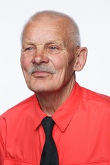 Portrait of a smiling old man over white background