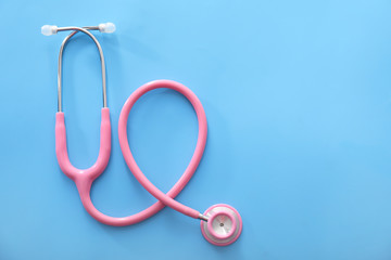 Medical stethoscope on color background. Health concept