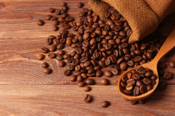 coffee beans in a bag on a wooden background