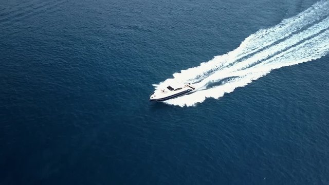 The closer look of the white speedboat in the water
