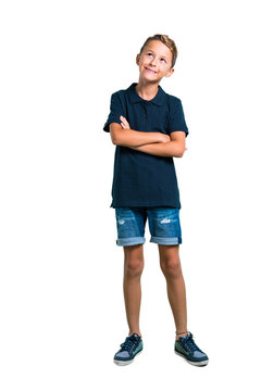 Full Body Of Little Boy Stand And Looking Up On White Background