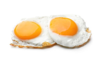 Tasty fried eggs on white background