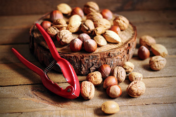 Nuts and nutcrackers on wood