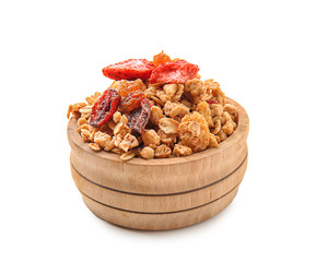 Bowl with granola and dried fruits on white background