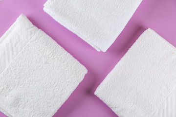 Soft towels on color background