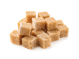 Brown cane sugar cubes on white background