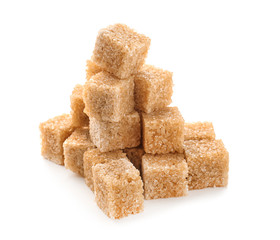 Brown cane sugar cubes on white background