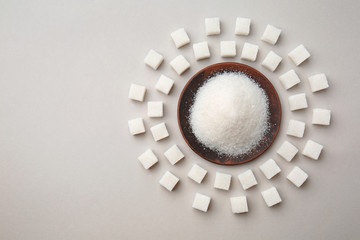 Composition made of refined sugar on light background
