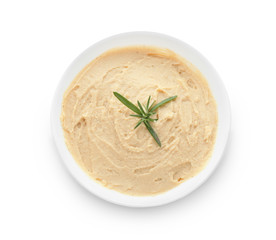 Bowl with tasty hummus on white background