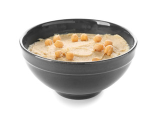 Bowl with tasty hummus on white background