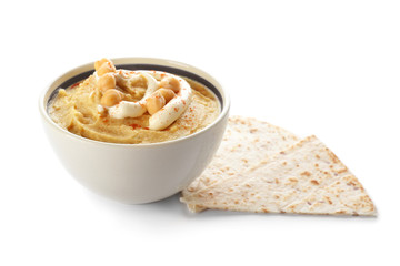 Bowl with tasty hummus and lavash on white background