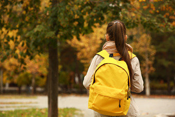 Cute girl with backpack going to school