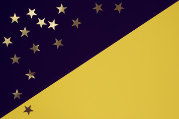 Festive dark violet and yellow background with stars