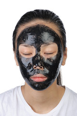Asian woman with black spa mask