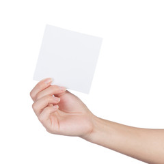 Female hand holding blank sheet of paper