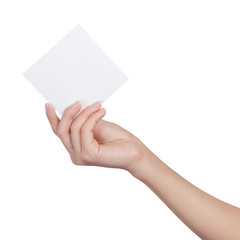 Female hand holding blank sheet of paper
