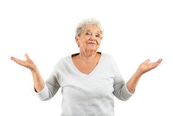 Portrait of elderly woman after making mistake on white background