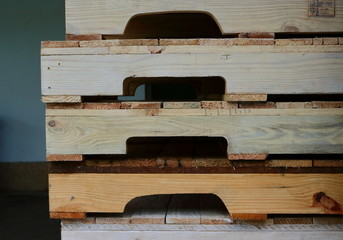 closeup picture of parts of wooden knockdown furniture arranged in stack