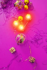 Christmas decoration on abstract background. New year eve celebration concept. Minimal ultra violet surrealism background.