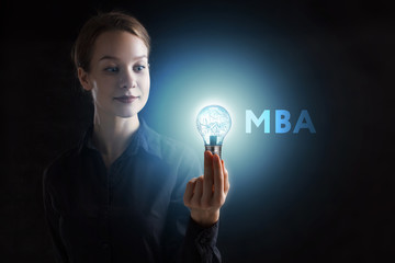 The concept of business, technology, the Internet and the network. A young entrepreneur working on a virtual screen of the future and sees the inscription: MBA