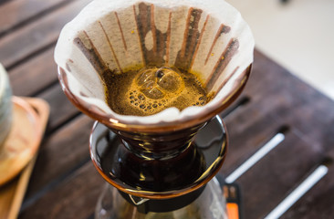 Barista making a cup of coffee soft focus image . 