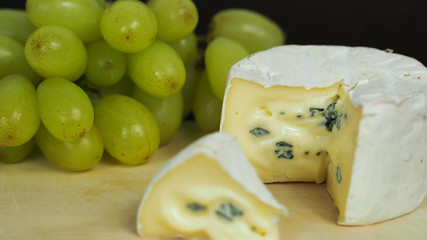 potpourri of mold cheese and white grapes