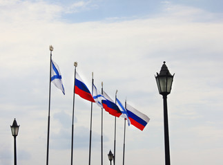 Russian flags and Naval Andrew's flags on sky background at Navy day celebration