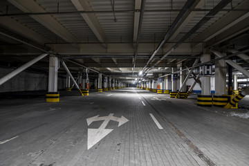 Underground illuminated parking with no people and stripped elements