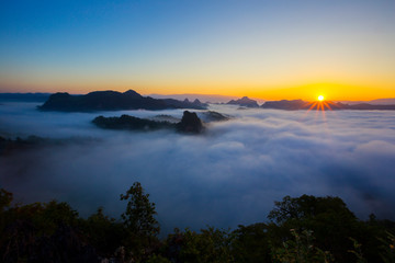 Morning sunrise over mist .