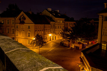 Long exposure night photo with beautiful buildings, small square and street lamps from Charles...