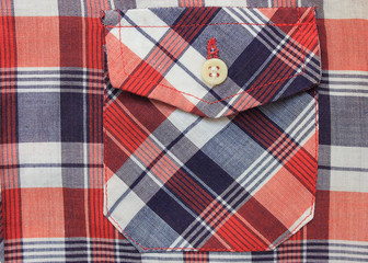 Plaid Shirt with Blue, White & Red Checkered Tartan Pattern. Close Up View of Front Pockets and Buttons on Stylish Fashion Shirt for Men and Women. Fabric Details with Seamless Squares Design Texture