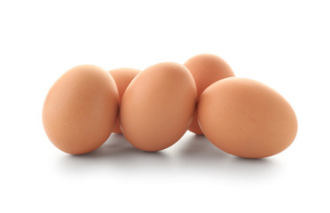 Raw chicken eggs on white background