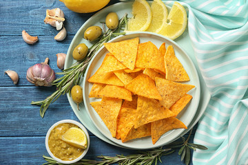 Beautiful composition with corn chips on color wooden background