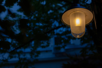 Streetlamp against a dark blue and black background