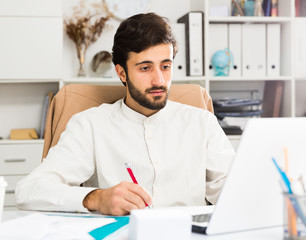 Fototapeta premium Office worker working at laptop