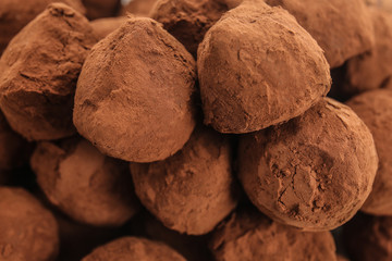 Fototapeta na wymiar Tasty chocolate truffles, closeup