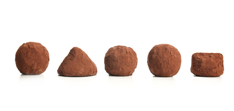 Tasty Chocolate Truffles On White Background