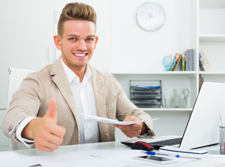 Manager with thumbs up gesture