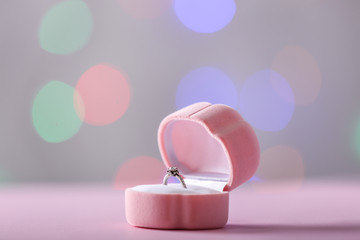 Beautiful ring in box on blurred background