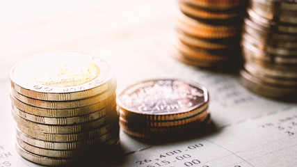 Stack of coins on account book