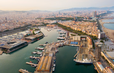 Fototapeta na wymiar Aerial view of old port in Barcelona city with of sailboats and yachts