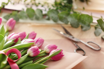 Obraz na płótnie Canvas Beautiful tulips on table of florist